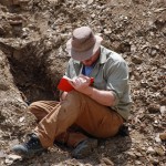 Dr. Heads recording field notes at one of the excavations. (Photo by M. Jared Thomas)